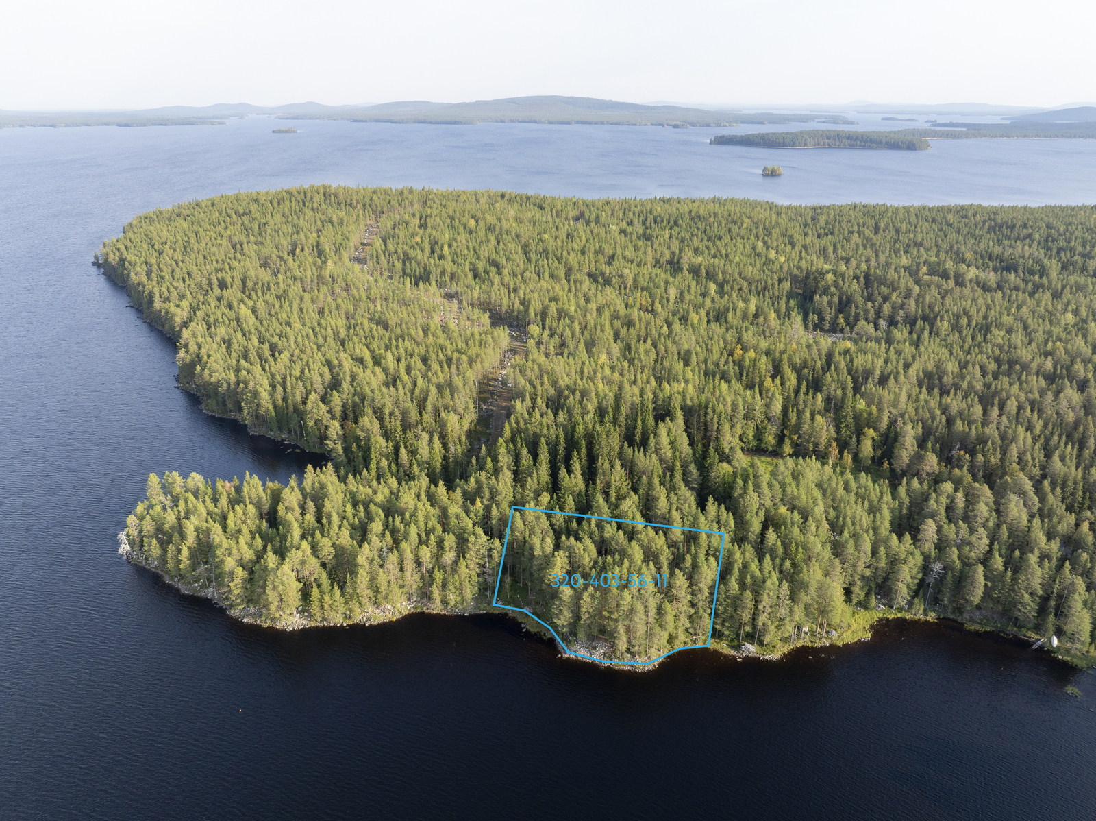 Ilmakuva tontista. Kuva järveltä päin tontille.